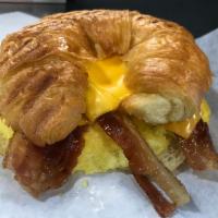 Breakfast Croissant · Scrambled eggs, American cheese & Bacon, butter Croissant. 