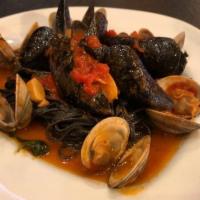 Black Linguini Posillipo · Clams and mussels in a light tomato sauce.