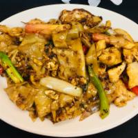 N3. Drunken Noodles Dinner · Stir-fried wide-rice noodles with Thai spicy sauce, basil leaves, onion, tomatoes and bell p...