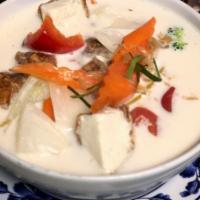COCONUT SOUP · Coconut milk soup with kalanga root, kaffir lime, lemongrass, onions, broccoli and carrots. ...