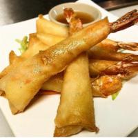 ANGEL SHRIMP · Wrapped in wonton and fried crispy golden with sweet citrus chili garlic sauce.