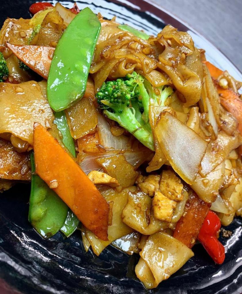 PAD SEE EW · Stir fry rice flat noodles with broccoli, onions, peppers, snow peas and carrots in a sweet soy sauce.