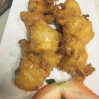 FRIED BANANA TEMPURA · drizzled with honey and coconut flakes