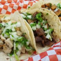 Tacos · Served with choice of tortilla and meat.