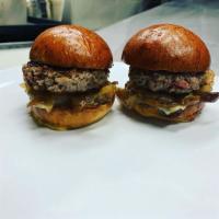 Impossible Sliders · VEGETARIAN 
2 oz. 2 sliders served with caramelized onions and garlic basil mayo. Brioche sl...