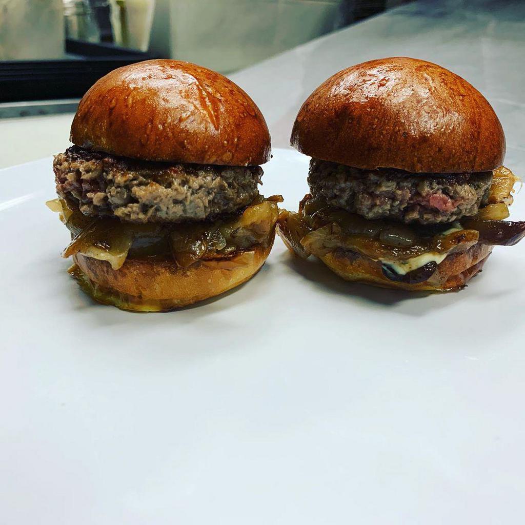 Impossible Sliders · VEGETARIAN 
2 oz. 2 sliders served with caramelized onions and garlic basil mayo. Brioche slider buns, impossible patties. 