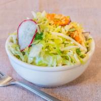 Slaw Side · Cabbage, radish, cilantro, red onion and lime. Vegan.