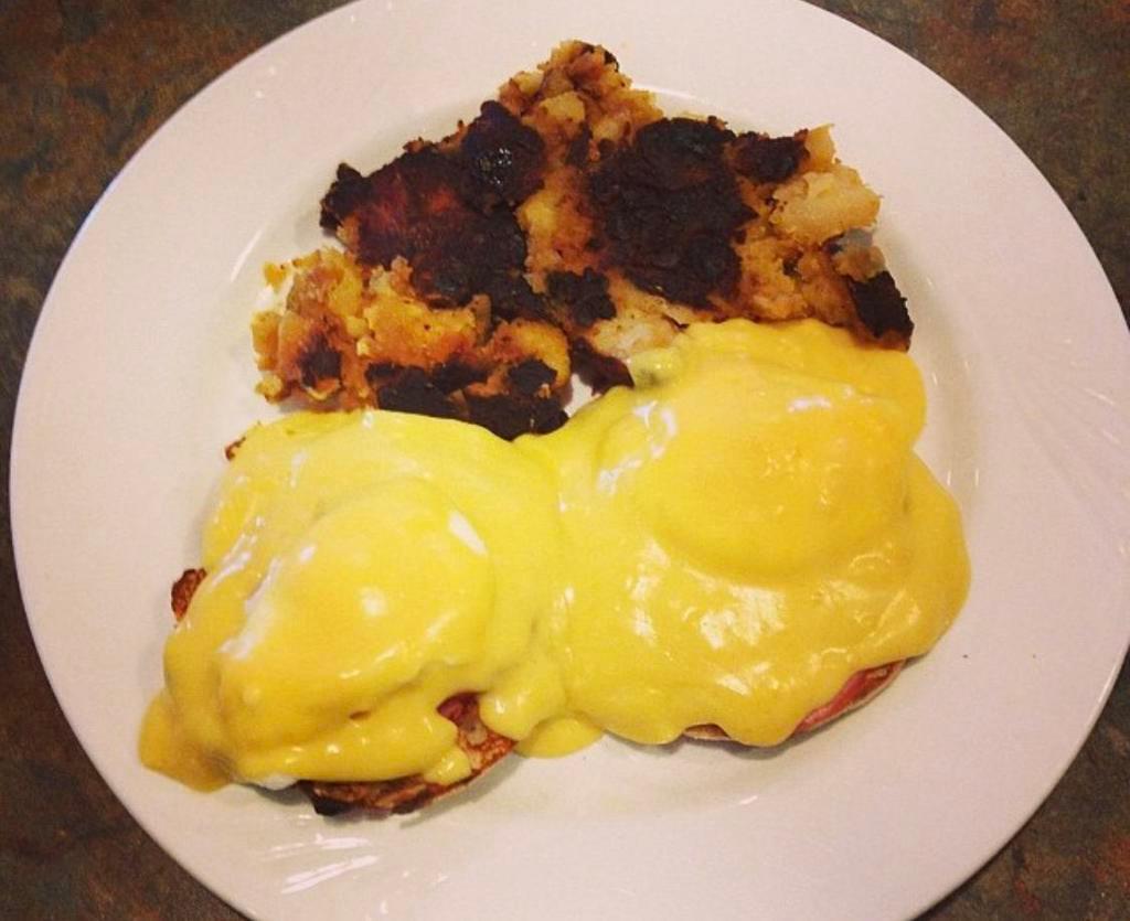 Eggs Benedict · 2 Poached Eggs on a Toasted English Muffin w/ Canadian Bacon, Hollandaise Sauce, and Home Fries.