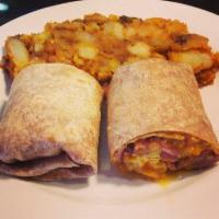 Breakfast Burrito · 3 scrambled eggs with ham, bacon, cheddar cheese and Tobasco sauce in a flour tortilla or wh...