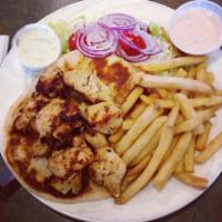 Chicken Souvlaki Platter · Served on pita bread with Greek salad and french fries.