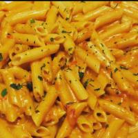 Penne Ala Vodka · Pink cream sauce and a touch of vodka.