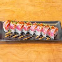 9. Forget Me Not Roll · Crab and unagi, topped with spicy tuna, seared tuna, and special sauce, tobiko, green onion....
