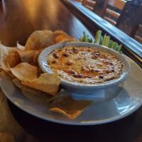 Buffalo Chicken Dip · Shredded chicken with our house-made buffalo sauce and cheeses.  Served with tortilla chips ...