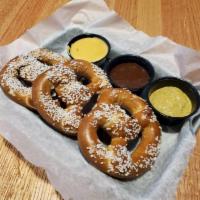 Soft Pretzels · 3 big, soft pretzels served with spicy mustard, nacho cheese and our house-made cinnamon car...