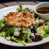 Balsamic Grilled Chicken Salad · A balsamic vinaigrette marinated chicken breast, grilled and served atop organic spring and ...
