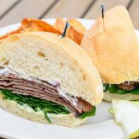 Roast Beef Sandwich · Thick-cut roast beef, pepper-jack cheese, grilled onions & mushrooms on a hoagie bun with a ...