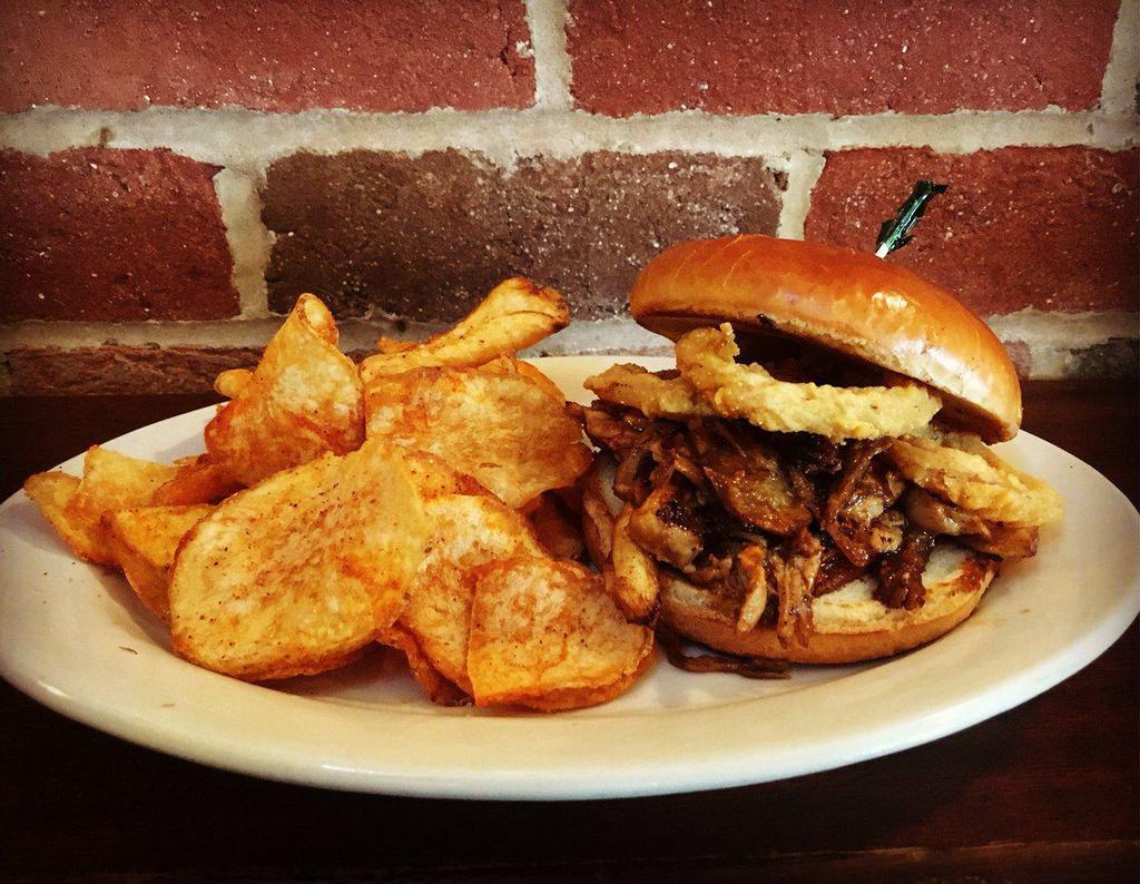 Southern BBQ Pork Sandwich · Slow-cooked, shredded pork roast, house-made BBQ sauce, and fried red onion on a grilled brioche bun.
