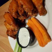 Prince Dean's Angel Wings · Chicken wings tossed in our signature sauce served with celery and carrot sticks.