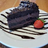 Chocolate Layer Cake · Four tiers of chocolate cake layered with a rich chocolate icing and finished with chocolate...