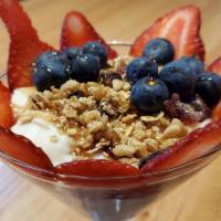 Yogurt Parfait · Greek yogurt topped with strawberries, blueberries, granola, and Chipotle agave. A sweet hea...