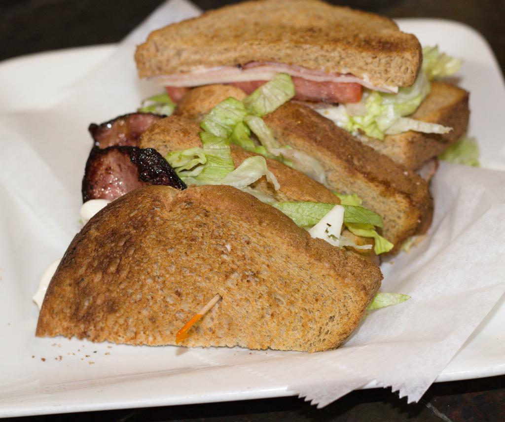 Metro Club · Smoked turkey, turkey bacon, Swiss cheese, tomato, mayo on toasted club wheat bread.