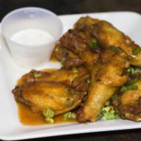 Highlands Wings · Homemade sweet spicy mango sauce blue cheese dressing.