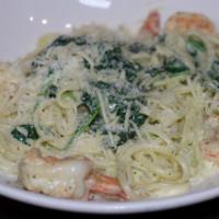 Gulf Shrimp Linguine · Pesto garlic cream sauce Parmesan cheese, baby spinach.