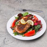 Grilled Salmon Salad · Grilled salmon cooked medium & served over a bed of mixed field greens with mandarin oranges...
