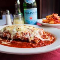 Eggplant Parmigiana · With a side of mostaccioli in our homemade marinara sauce