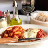 Chicken Parmigiana · Lightly breaded, topped with mozzarella and marinara sauce. Served with a side of mostacciol...