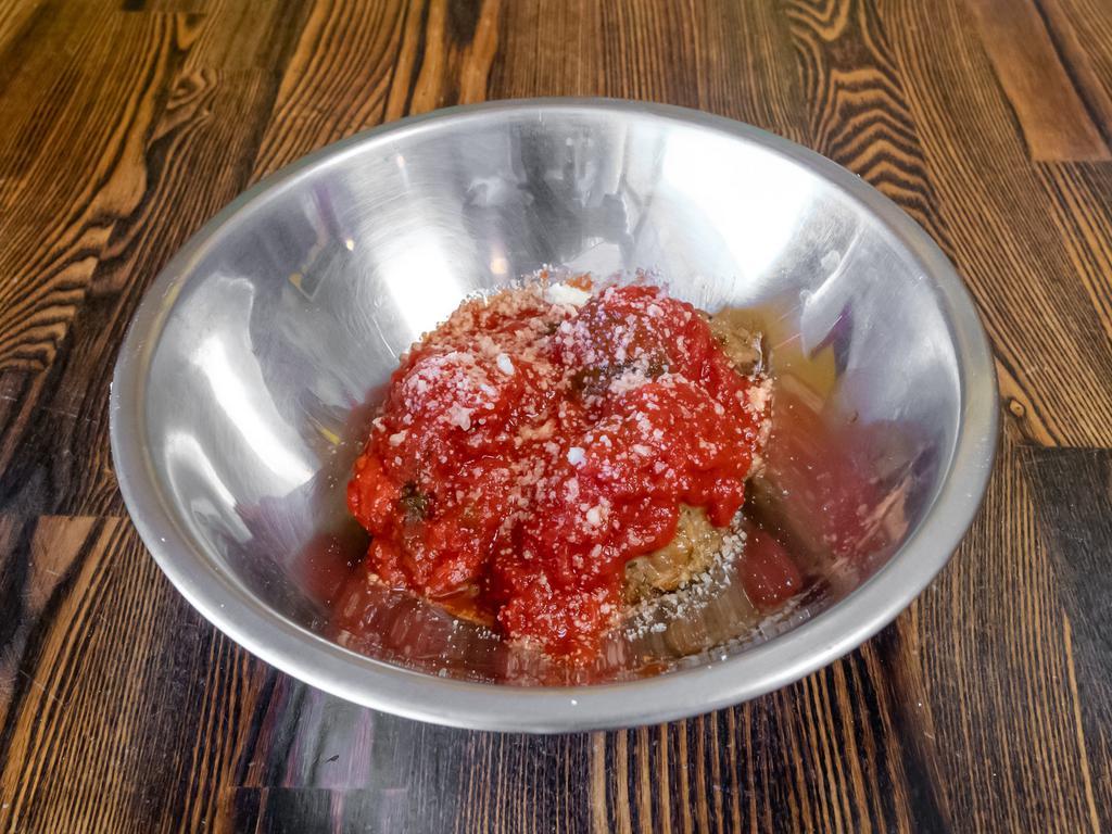 Housemade Meatballs · 14 ingredient House made meatballs baked to perfection. Served in a spiced marinara. Topped with grated parmesan. Melted mozzarella optional.