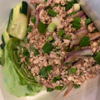 Larb Pork Salad · Ground pork, onion, rice powder, mint, cilantro in chili-lime dressing.