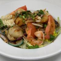 Seafood Salad · Prawns, calamari, mussel, fish, scallop, red onion, cilantro, tomato, mint, lemongrass in me...