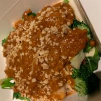 Pra Ram · Marinated chicken served with steamed broccoli, carrot, spinach topped Kao-Sarn peanut sauce.