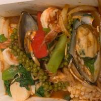 Pad Ped Seafood · Prawns, calamari, mussel, fish, scallop sauteed with peppercorn, kra-chai in red curry paste.