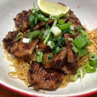 Grilled Pork Noodle · Egg noodle, cilantro, crush peanut topped with grilled marinated pork. Served with chicken b...