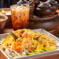 Pineapple Fried Rice · Fried rice with chicken and prawns, onion, raisin, pineapple, and cashew nut.
