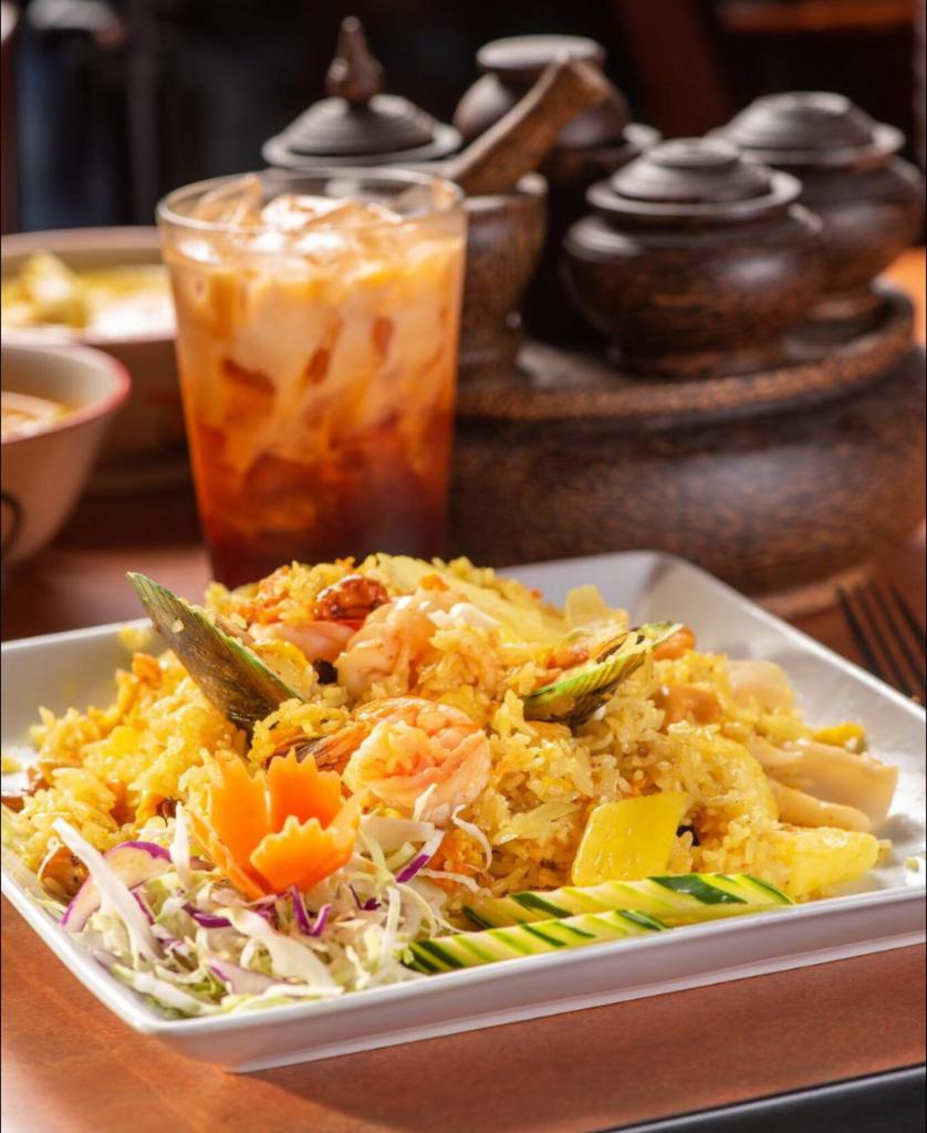 Pineapple Fried Rice · Fried rice with chicken and prawns, onion, raisin, pineapple, and cashew nut.