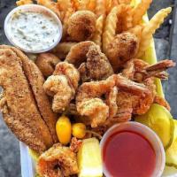 Fish, Shrimp and Oyster Combo Meal · Includes Fish, 5 Jumbo Shrimp, 3 Oysters, 2 Side Orders, 3 Hush Puppies, 1 Sweet Hawaiian Di...