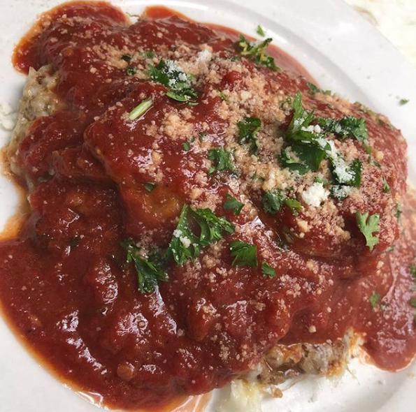 Stuffed Chicken Parmigiana Dinner · Boneless breaded chicken topped with imported mozzarella cheese in house red sauce, layered with an eggplant parmigiana. Served with pasta or potato and vegetable