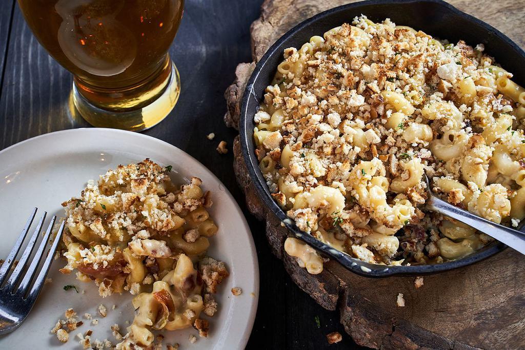 Cast Iron Macaroni and Cheese · Jumbo elbow macaroni, Arizona Gold, smoked mozzarella and cheddar blend, hatch green chiles and pretzel bite mustard crust. Add applewood smoked bacon for an additional charge.