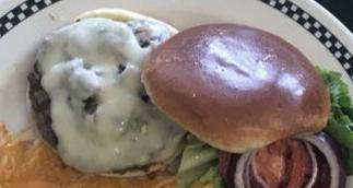 Mushroom and Swiss Burger · Sauteed mushrooms and Swiss cheese cover the All-American burger.