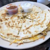 Quesadilla Breakfast · 2 large grilled tortillas with mixed fresh vegetables, eggs, cheddar and Jack cheese and cho...