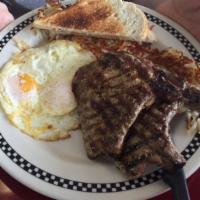 Pork Chops and Eggs · Enjoy 2 grilled pork chops, served with 2 eggs, hash browns, and toast.