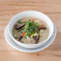 S2. Tom Kha Soup · Mushrooms, cabbage, onions, tomatoes and exotic herbs in coconut milk broth with cilantro an...