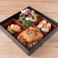 R1. Bento Box · Choice of teriyaki chicken or salmon. Includes 4 pieces of California roll, green salad, 3 p...