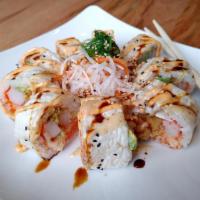 Monster Roll · Salmon, avocado, crab, cucumber, lobster salad, shrimp tempura, flying fish eggs inside and ...