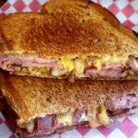 Dirty Frank · Grilled corned beef w/ sauteed onions and musrooms, dill pickles, smoked swiss, dijon mustar...