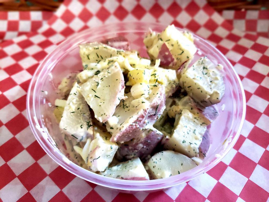 Dillytato Salad · This side dish is created with a mixture red potatoes, hard boiled eggs, onions, pickles, and fresh dill tossed with a creamy dressing.