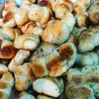 3 Pieces Garlic Knots with Sauce · Rolled baked dough. 